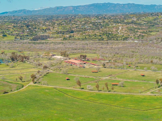 aerial view with a mountain view and a rural view