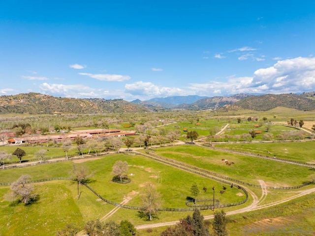 birds eye view of property with a mountain view and a rural view