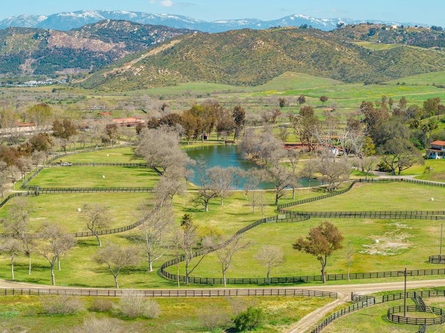 mountain view featuring a water view and a rural view