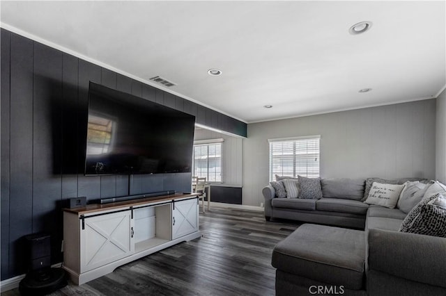 living room with dark hardwood / wood-style floors and ornamental molding