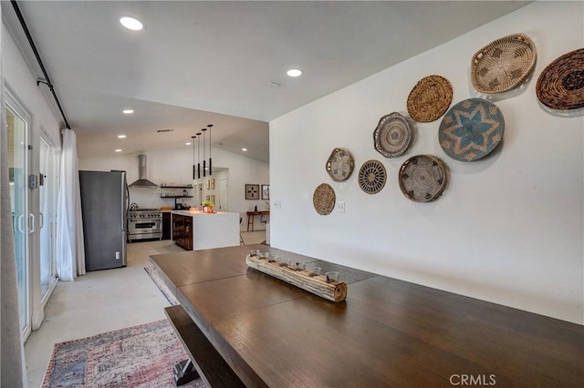 dining room featuring lofted ceiling