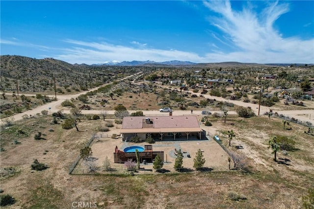 drone / aerial view featuring a mountain view