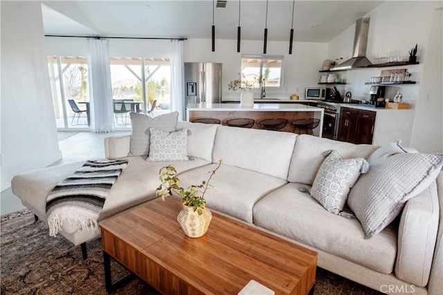 living room featuring sink