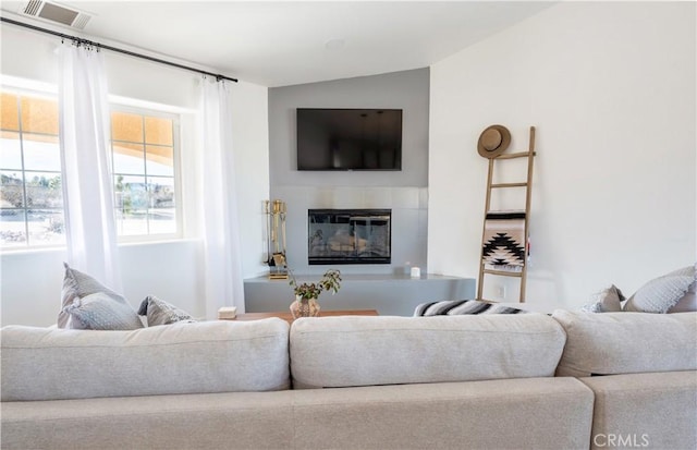 living room featuring lofted ceiling