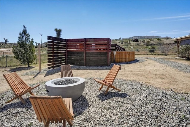 view of patio featuring an outdoor fire pit