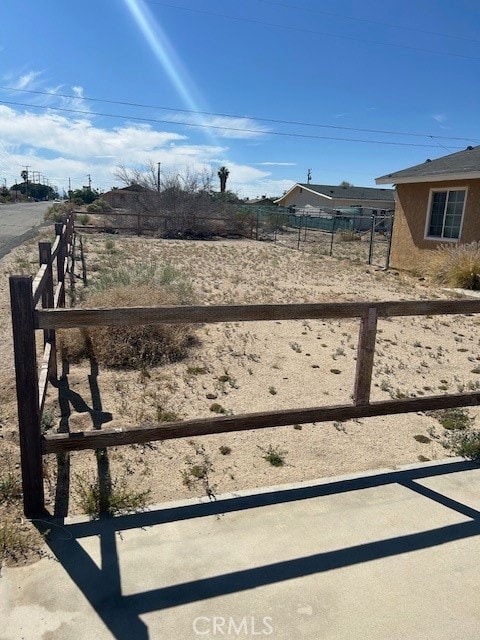 view of yard with a rural view