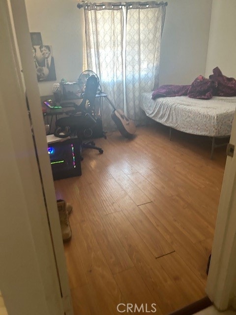 bedroom featuring hardwood / wood-style flooring