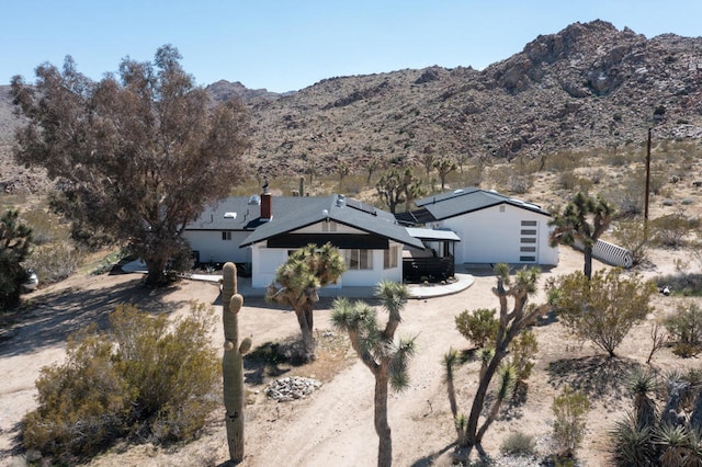 view of front of home featuring a mountain view