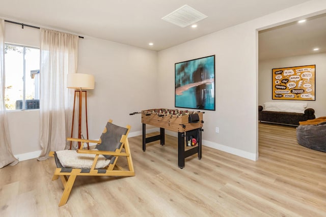 sitting room with light hardwood / wood-style floors