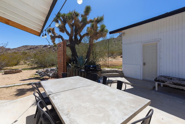 view of patio with a mountain view