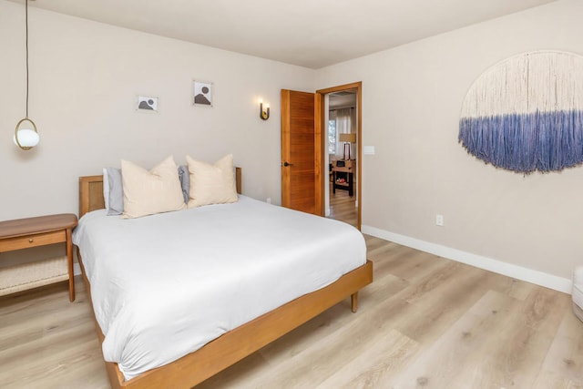 bedroom with light hardwood / wood-style flooring