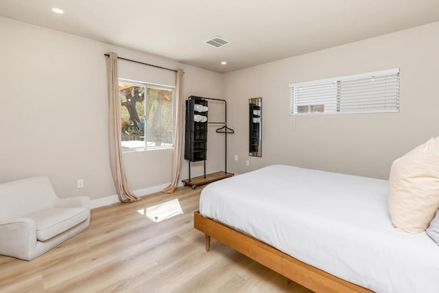 bedroom with light hardwood / wood-style floors