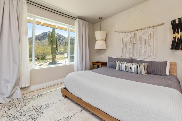 bedroom featuring multiple windows