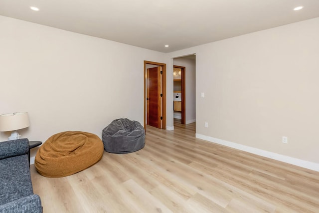 sitting room with light wood-type flooring