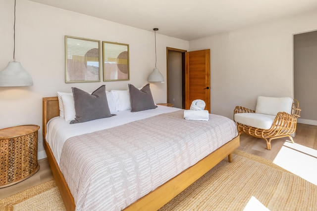 bedroom with hardwood / wood-style flooring