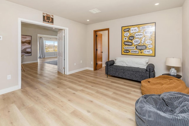 sitting room featuring light wood-type flooring