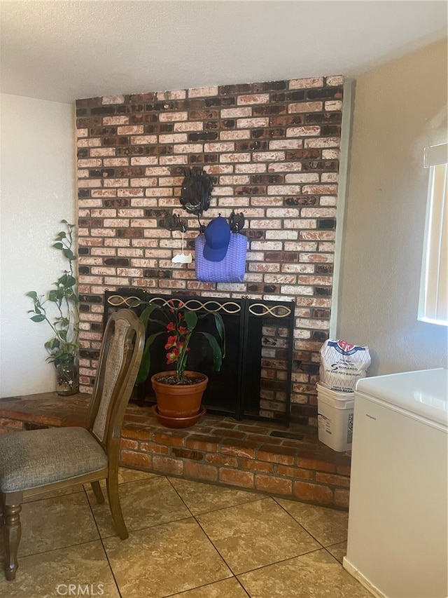 interior space featuring tile patterned floors and white refrigerator