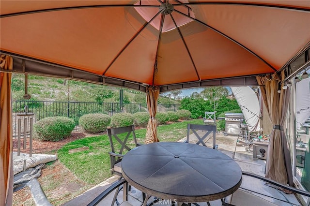 view of patio featuring a gazebo and a grill