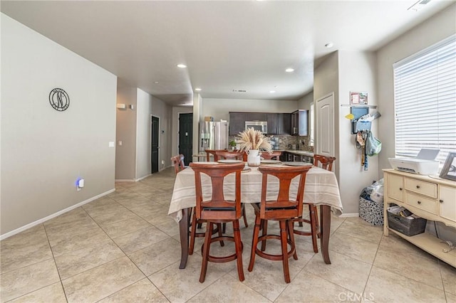 dining area with light tile patterned floors