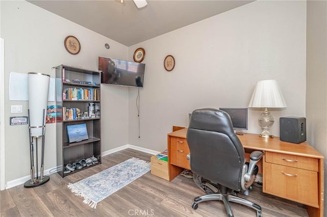 office space with lofted ceiling, ceiling fan, and dark hardwood / wood-style floors