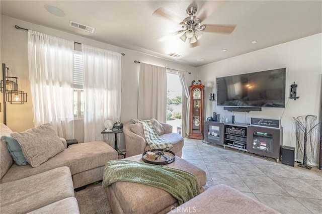 living room featuring ceiling fan and light tile patterned floors