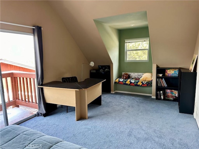 carpeted office space with vaulted ceiling