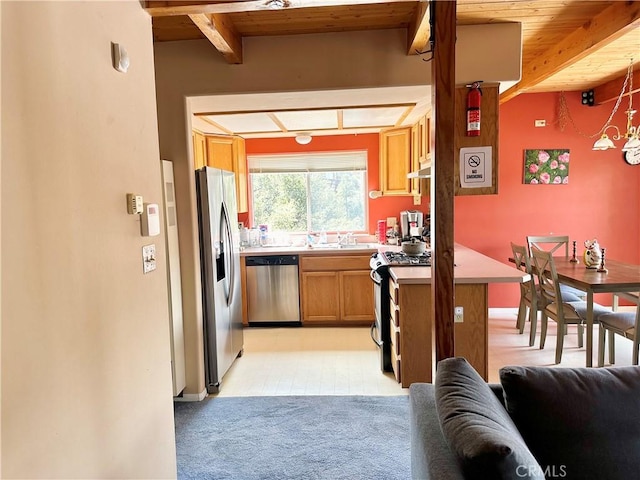 kitchen with wooden ceiling, hanging light fixtures, stainless steel appliances, beamed ceiling, and light carpet