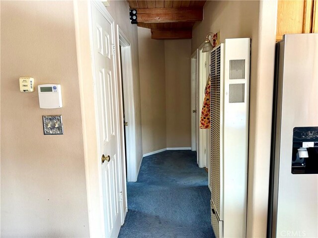 2005 Zermatt Dr, Pine Mountain Club, CA 93222 - corridor with a heating unit, a wood ceiling with exposed beams, and dark carpet
