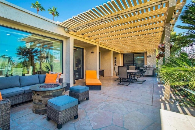 view of patio featuring a pergola and an outdoor living space with a fire pit