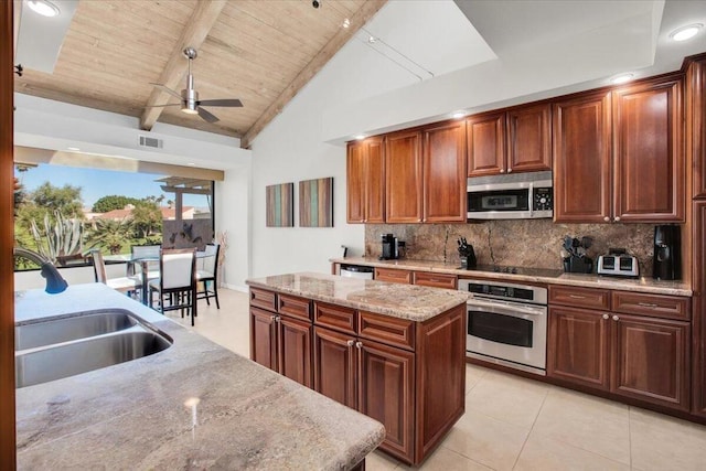 kitchen with tasteful backsplash, a center island, lofted ceiling with beams, appliances with stainless steel finishes, and wooden ceiling