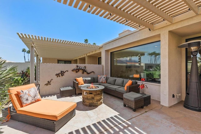 view of patio with an outdoor living space with a fire pit and a pergola