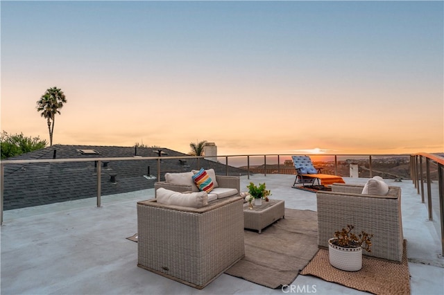 view of patio terrace at dusk