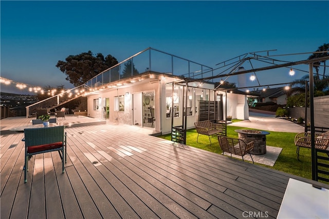 deck at dusk with a lawn