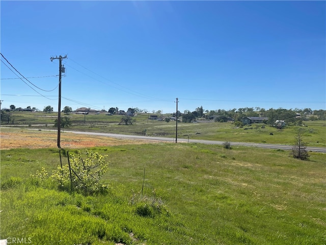 view of yard with a rural view