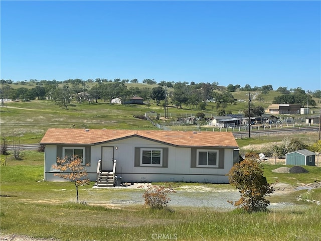 view of front of home featuring a rural view