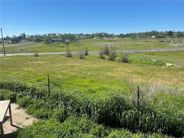 view of yard with a rural view