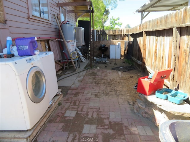 view of patio featuring washer / dryer and water heater