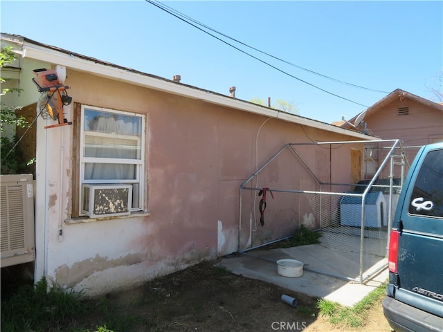 view of property exterior with a patio