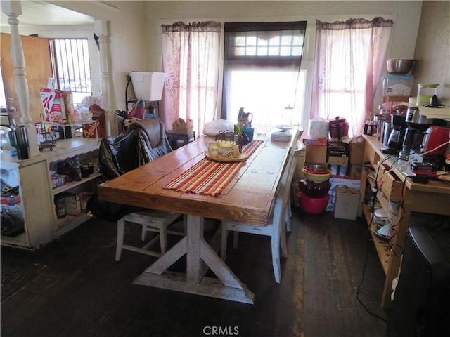 dining area featuring dark wood-type flooring