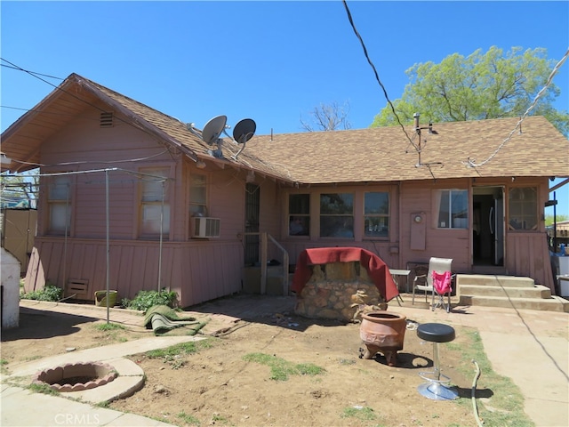 rear view of property with a patio and cooling unit