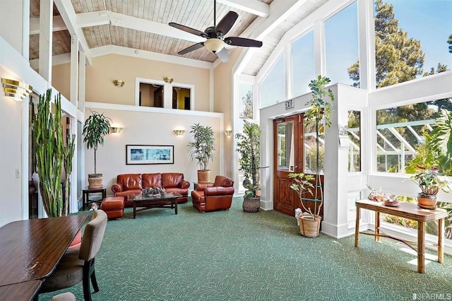 sunroom / solarium with ceiling fan, lofted ceiling, a wealth of natural light, and wooden ceiling