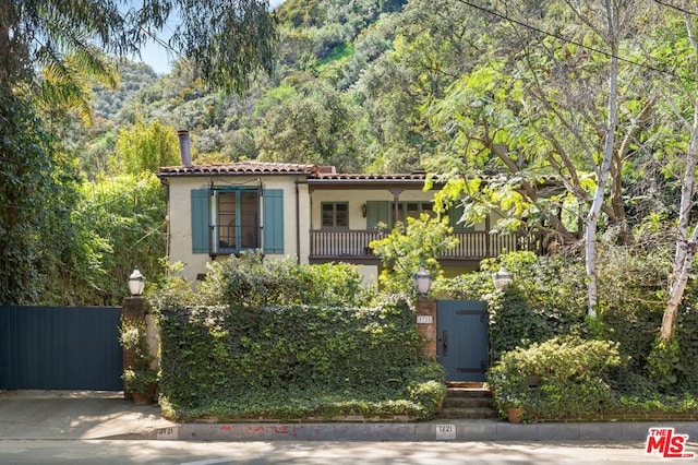 mediterranean / spanish home featuring a balcony