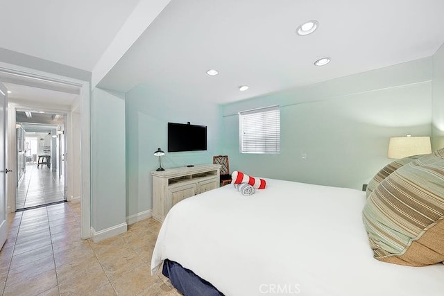 tiled bedroom with multiple windows