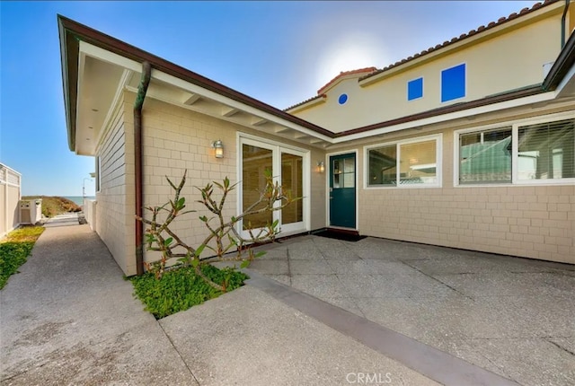 doorway to property with a patio