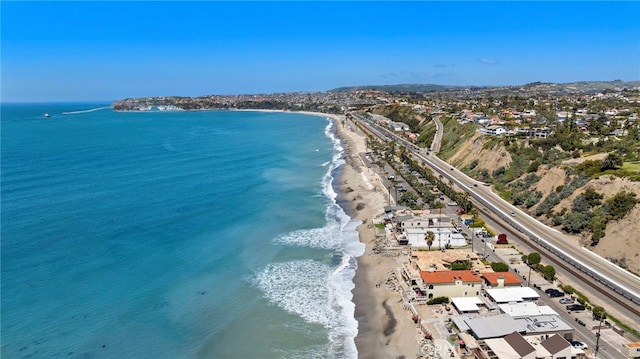 aerial view featuring a view of the beach and a water view