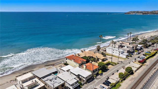 drone / aerial view with a view of the beach and a water view