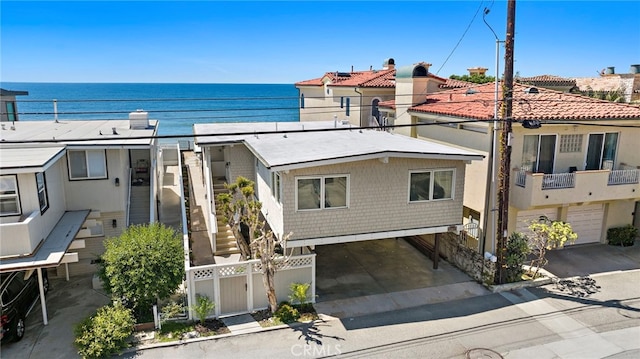 view of front facade with a water view