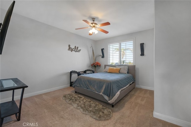 bedroom featuring ceiling fan and light colored carpet