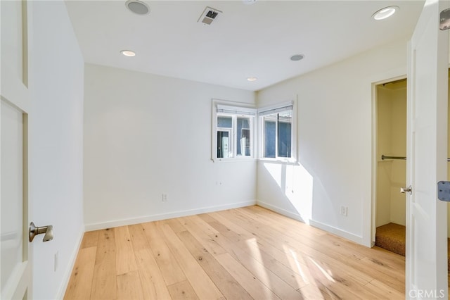 unfurnished bedroom featuring light wood-type flooring