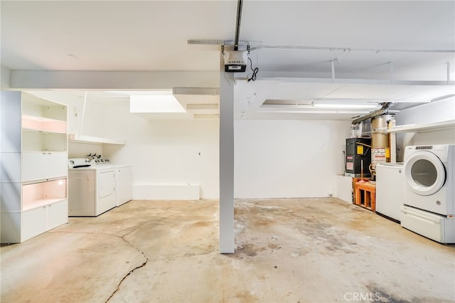 garage featuring washer and clothes dryer and a garage door opener